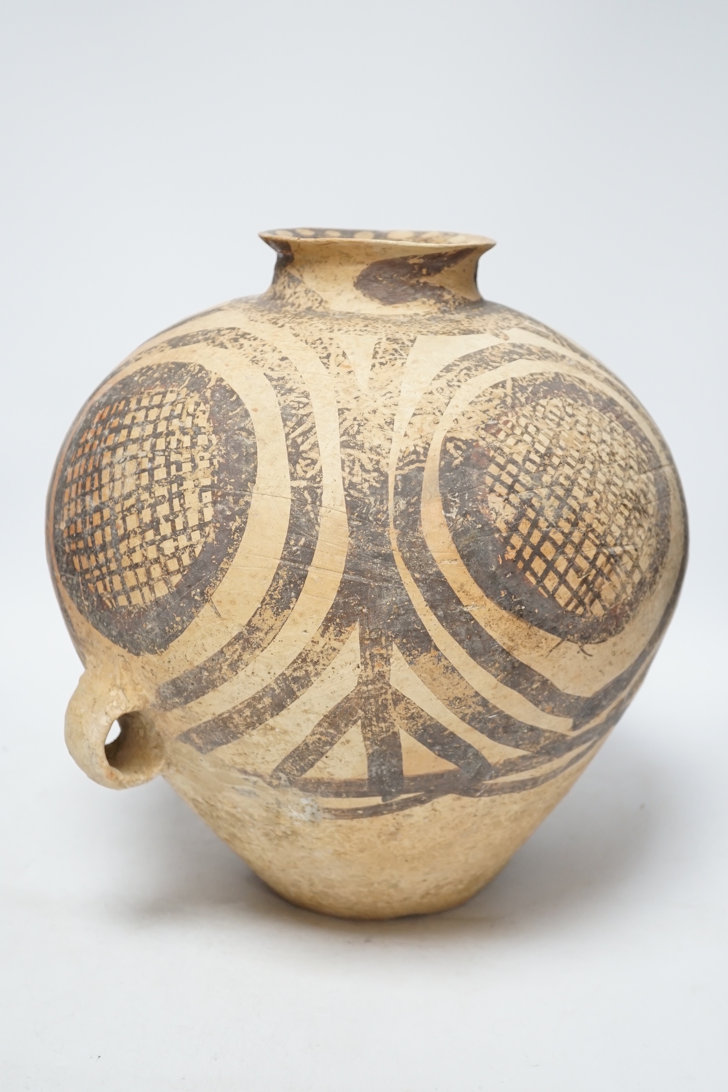 A large Chinese black painted pottery jar, Neolithic, Machang period, with Oxford Thermoluminescence certificate, 33cm